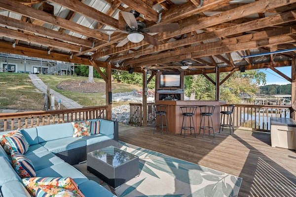 Welcome to Sun Kissed Cove. Covered dock with bar, TV and sectional perfect to enjoy all day.