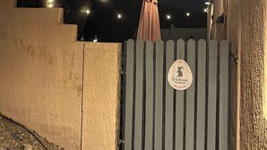 A gated area with a sign that reads "Welcome Friends." - Room with mountain views/hiking, private entrance & peaceful courtyard. (Phoenix)