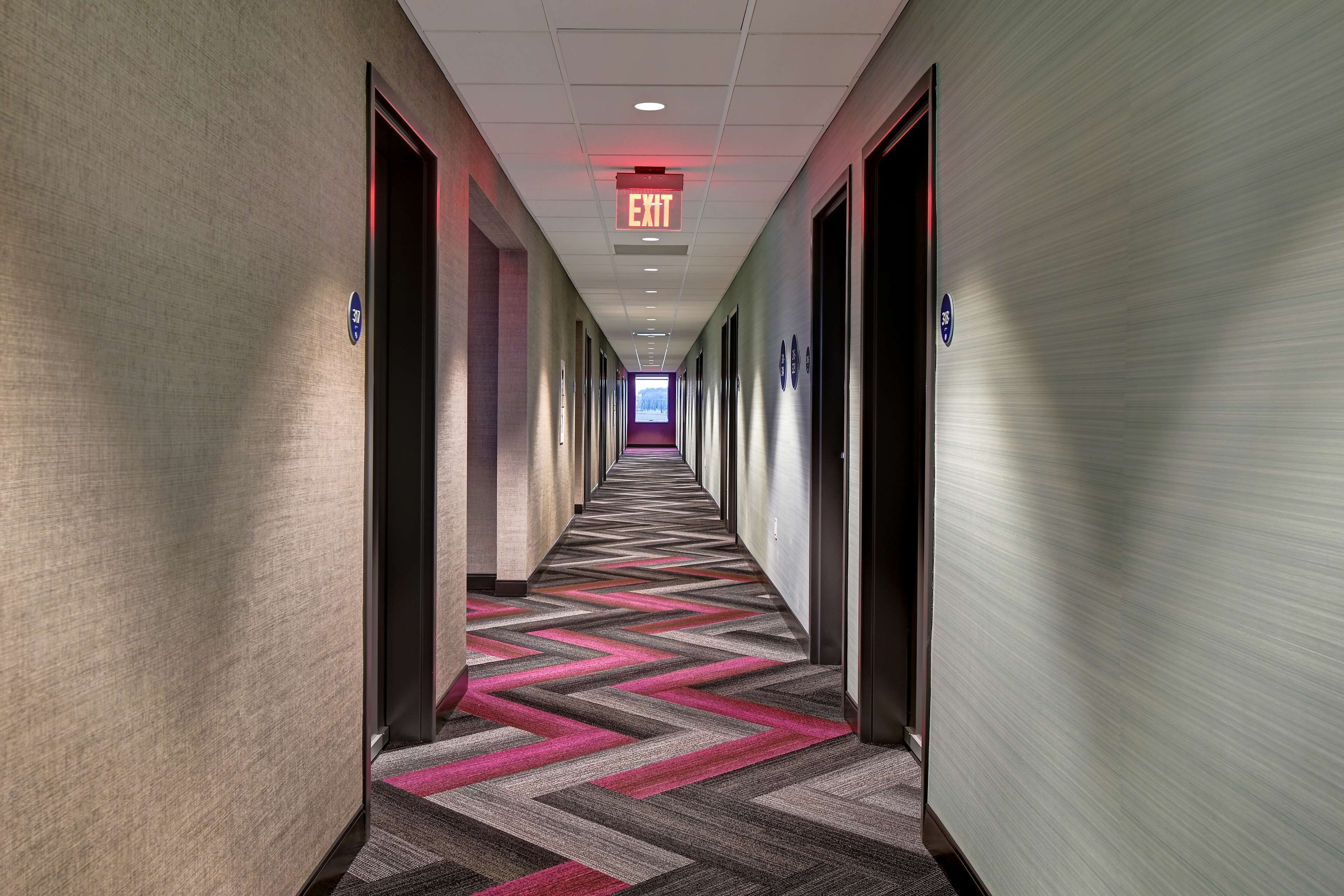 premium bedding, pillow-top beds, desk, laptop workspace