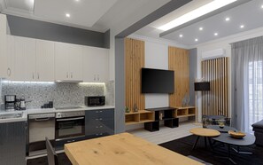 Enjoy cooking in the fully equipped kitchen with oven, microwave, and dining area.