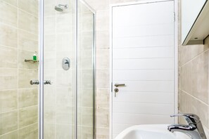 Shower, towels, soap, toilet paper