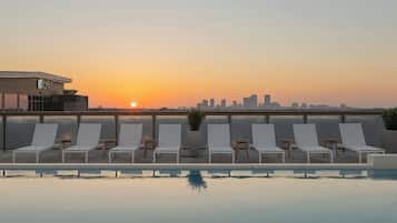 Outdoor pool, open 6:00 AM to 11:00 PM, sun loungers