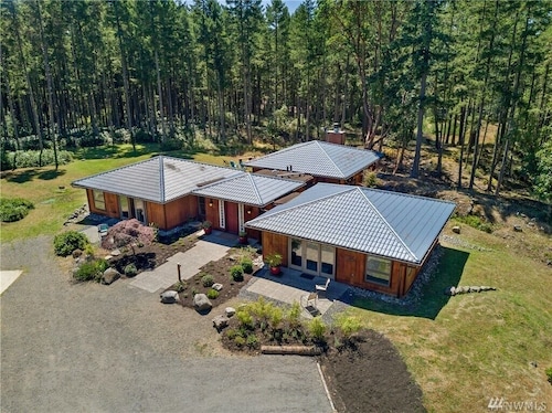 Luxury four bedroom home on sixteen acres of wooded privacy.