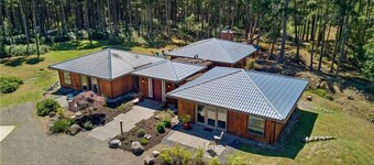 Luxury four bedroom home on sixteen acres of wooded privacy.