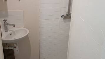 Shower, hair dryer, towels, toilet paper