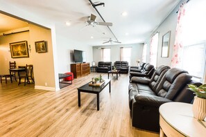 Deluxe House | Living area | 70-inch flat-screen TV with digital channels, TV, streaming services