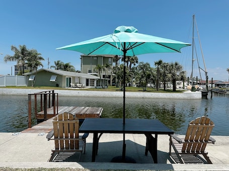 Outdoor dining. Water Front Home on Canal; Access to the Gulf of Mexico.