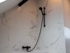 Bathtub, hair dryer, towels