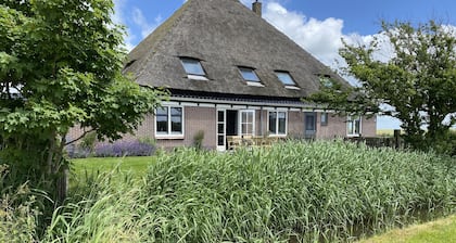 Spacious vacation home in farmhouse, only 2 km from beach in nature reserve.