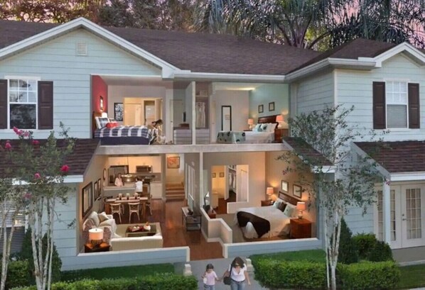 A two-story house with a dining area, kitchen, and two bedrooms.