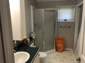 Bathtub, towels, soap, toilet paper