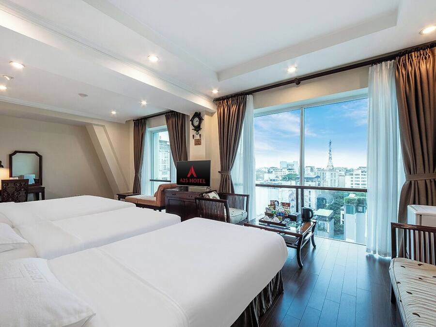 Family Suite | Minibar, in-room safe, blackout drapes, iron/ironing board