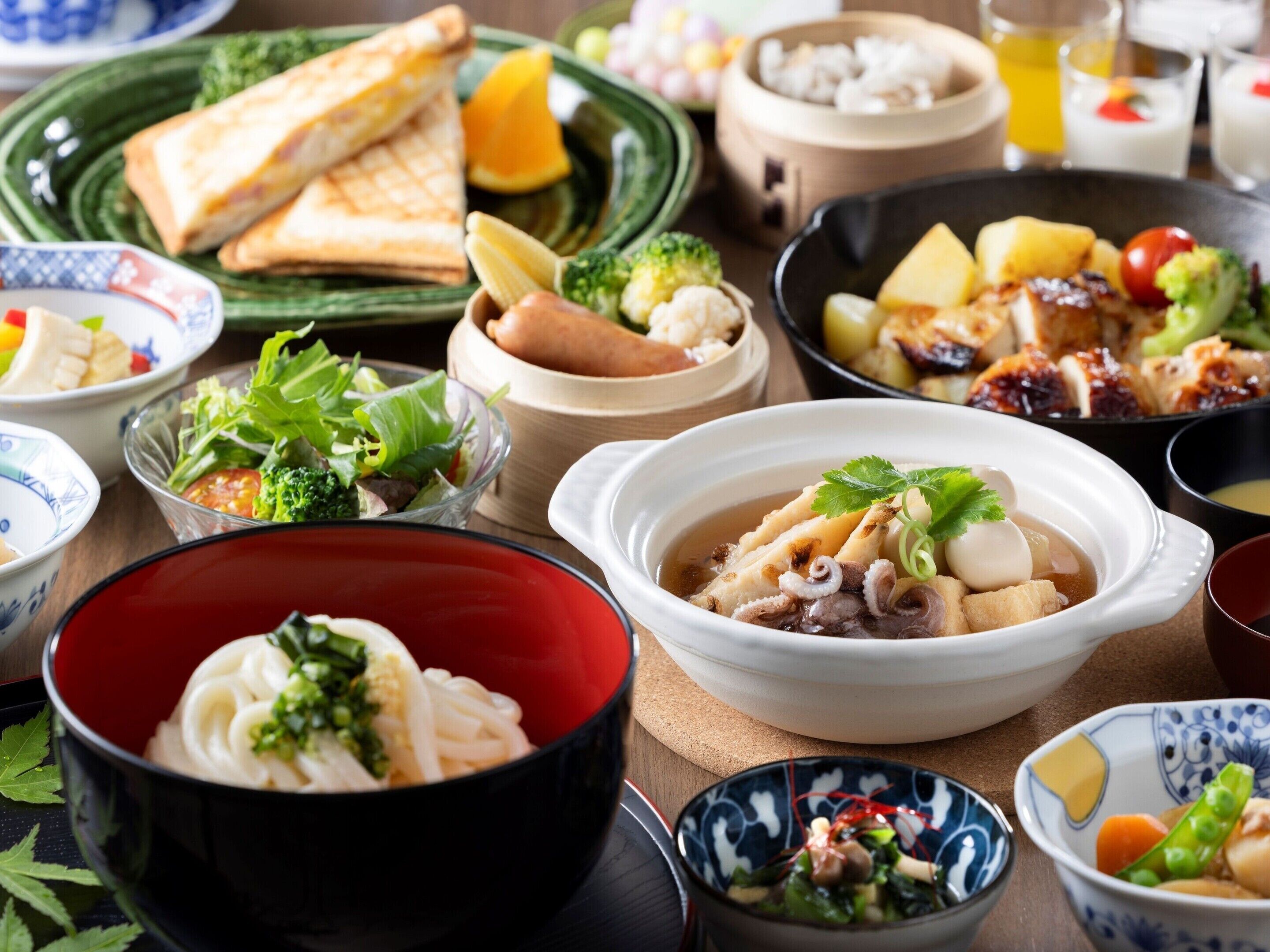 A variety of dishes in bowls and plates, suggesting a meal setting.