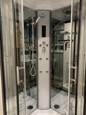 Shower, hair dryer, towels, soap