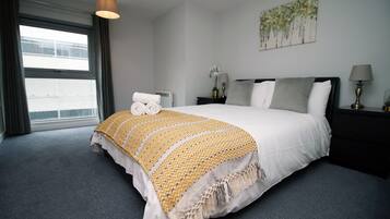 1 bedroom, desk, iron/ironing board, travel crib