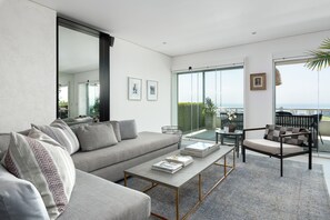 Luxury Apartment | Living room | 45-inch flat-screen TV with cable channels, TV - Ocean View Drive 119B (Cape Town)