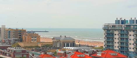 A coastal cityscape with a view of the beach and ocean.