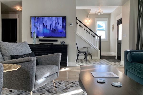 Sun drenched living room with 55" smart TV with Samsung Plus TV and Sonos.