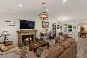 Smart TV, fireplace, books, stereo