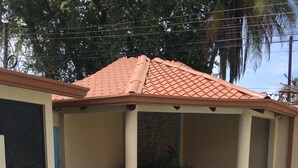 A swimming pool with a tiled deck, a covered seating area, and a door. - Coco beach Guanacaste Costa Rica Natural Fun!!!!! (Coco)