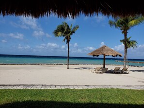 On the beach, sun-loungers, beach towels