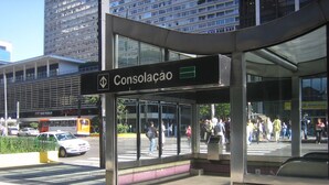 A modern building with a sign reading "Consolação" and a glass entrance.