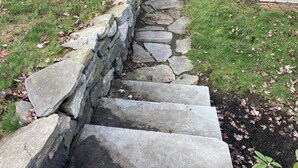 A stone staircase leading up to a house. - Rockmere Inn (Marblehead)