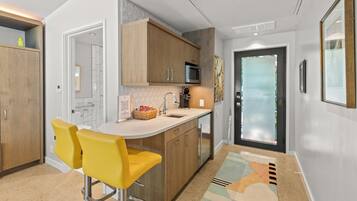 Fridge, microwave, coffee/tea maker, cookware/dishes/utensils