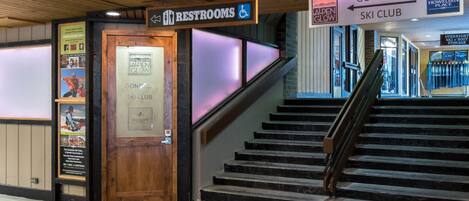 A staircase leading to the ski club and restrooms.