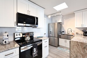 Microwave, stovetop, dishwasher, coffee/tea maker