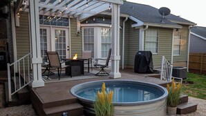 A covered patio with outdoor furniture, a hot tub, and a barbecue grill. - Few Mins to Ballantyne-Pet Friendly-1 Level Home-Private Plunge Pool in Backyard (Pineville)