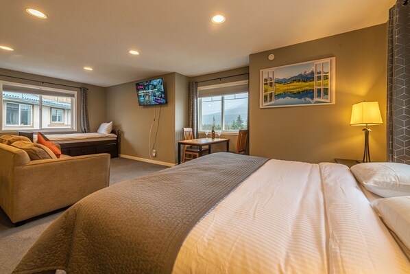 Family Studio Suite | Living area | Flat-screen TV, fireplace, Netflix, streaming services - Banff Boundary Lodge Mountainview Studio (Harvie Heights)