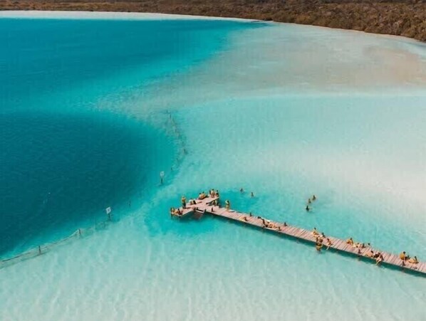 Guests can enjoy access to the turquoise sea from this simple pier.