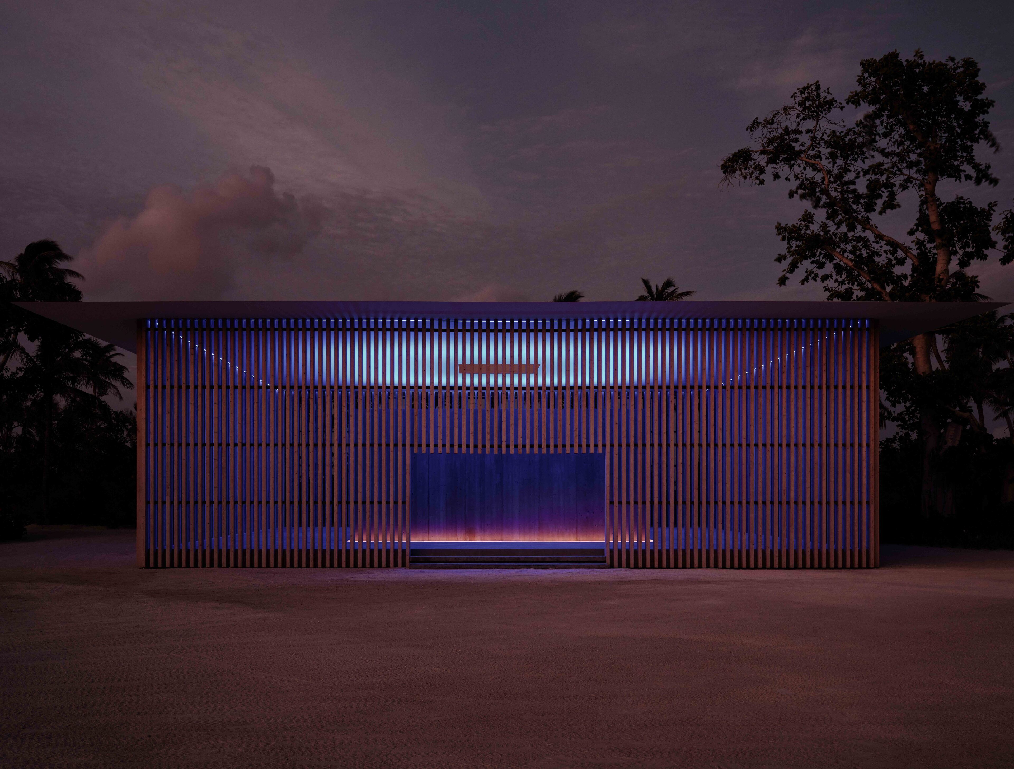 A modern building with a flat roof and vertical slats.