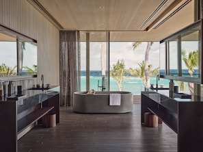 Separate tub and shower, rainfall showerhead, designer toiletries