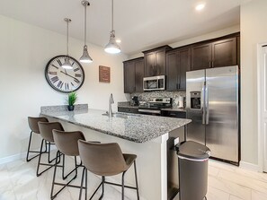 Fridge, microwave, oven, stovetop - ✨ 5BR/4BA Townhouse w/ Private Pool, Themed Rooms & Resort Pools, Lazy River | 10 Minutes to Disney (Kissimmee)