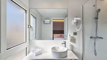 Hair dryer, towels, soap, shampoo