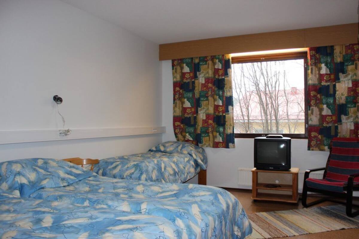 Desk, blackout drapes, iron/ironing board, individually furnished