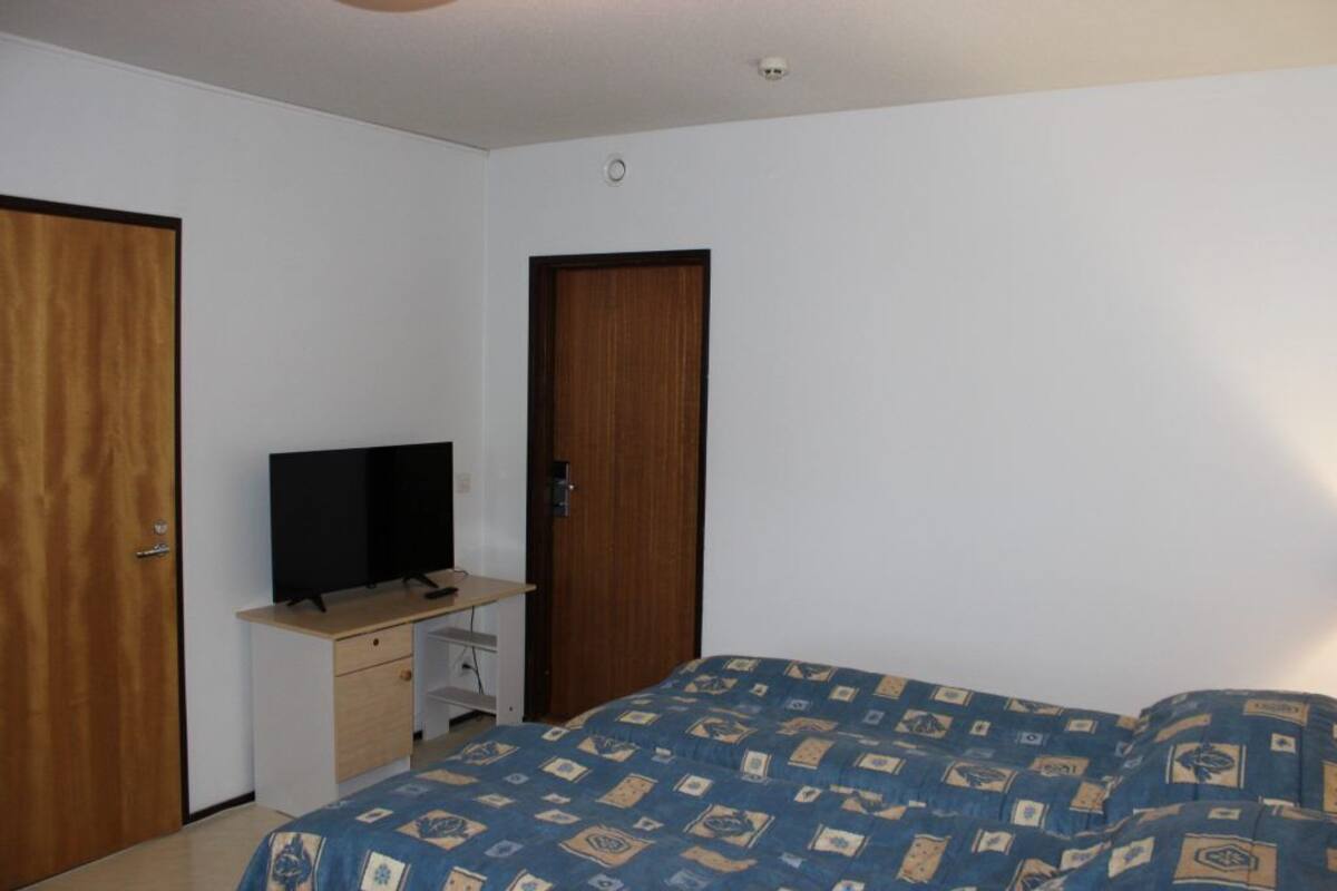 Desk, blackout drapes, iron/ironing board, individually furnished