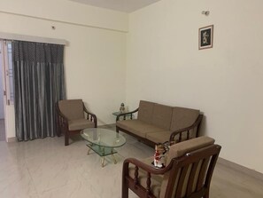 Living area - Smartly laid two bedroom apartment with kitchen ,simply furnished for homstay (Varanasi)