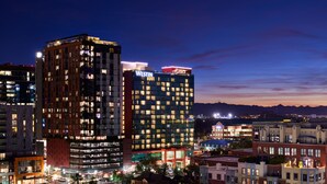 A high-rise hotel with multiple floors, illuminated windows, and a prominent 'WESTIN' sign. - The Westin Tempe (Tempe)