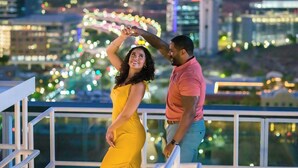 A couple dancing on a balcony with a cityscape view. - The Westin Tempe (Tempe)