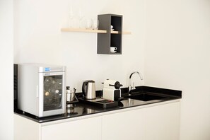 Fridge, stovetop, coffee/tea maker, cookware/dishes/utensils