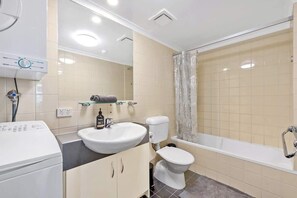 Combined shower/bathtub, hair dryer, towels, soap