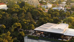 A hotel with a rooftop terrace, surrounded by trees and buildings. - SAY Hotel (Kifisia)