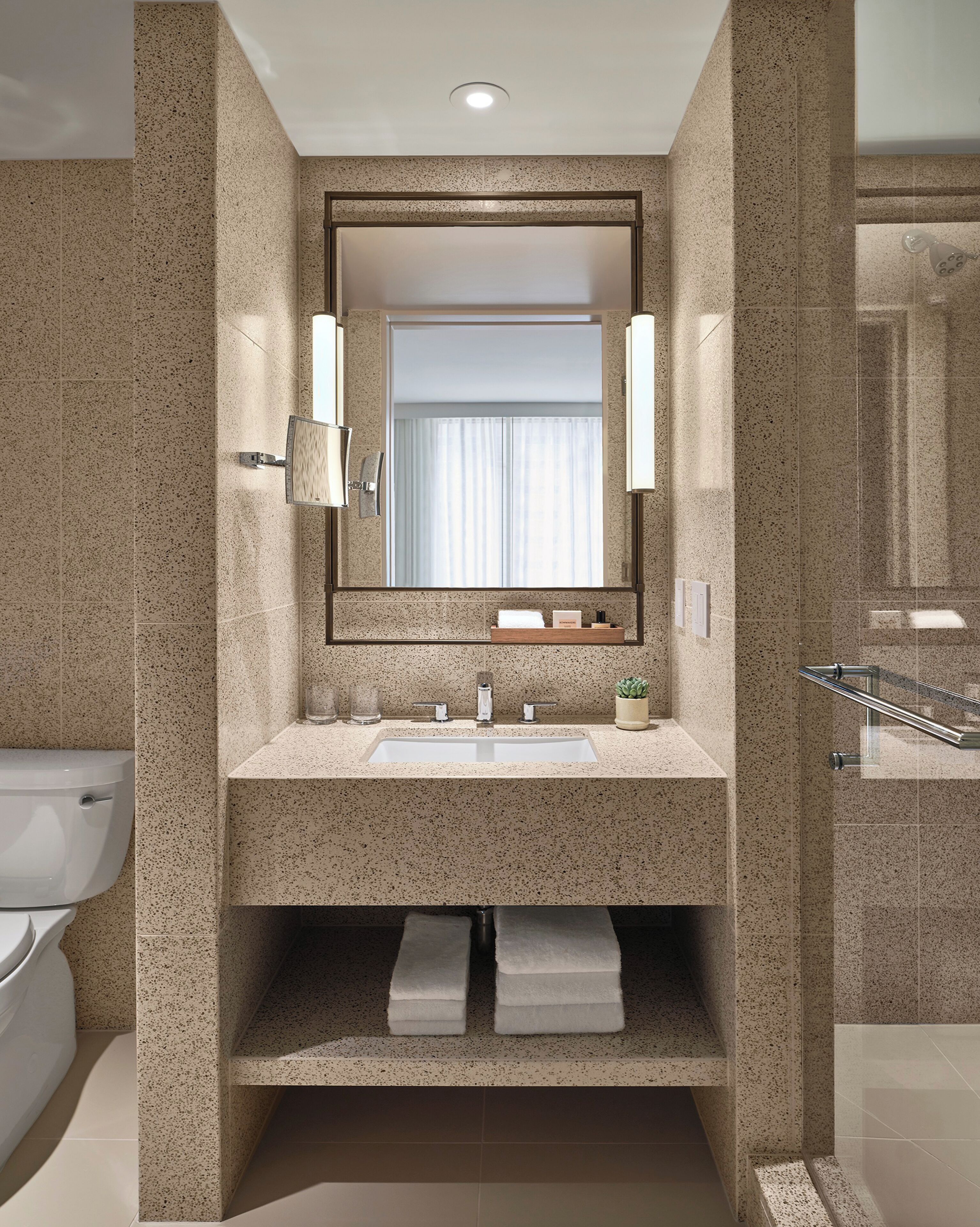 designer toiletries, hair dryer, bathrobes, slippers