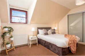 2 bedrooms, premium bedding, iron/ironing board, travel cot