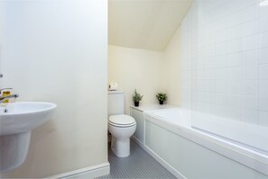 Bathtub, hair dryer, towels