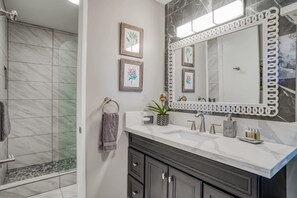 Shower, hair dryer, towels, shampoo