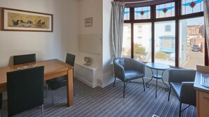 Apartment | Living area | 32-inch flat-screen TV with satellite channels, TV - Apartment 3 At Khyber (Whitby)